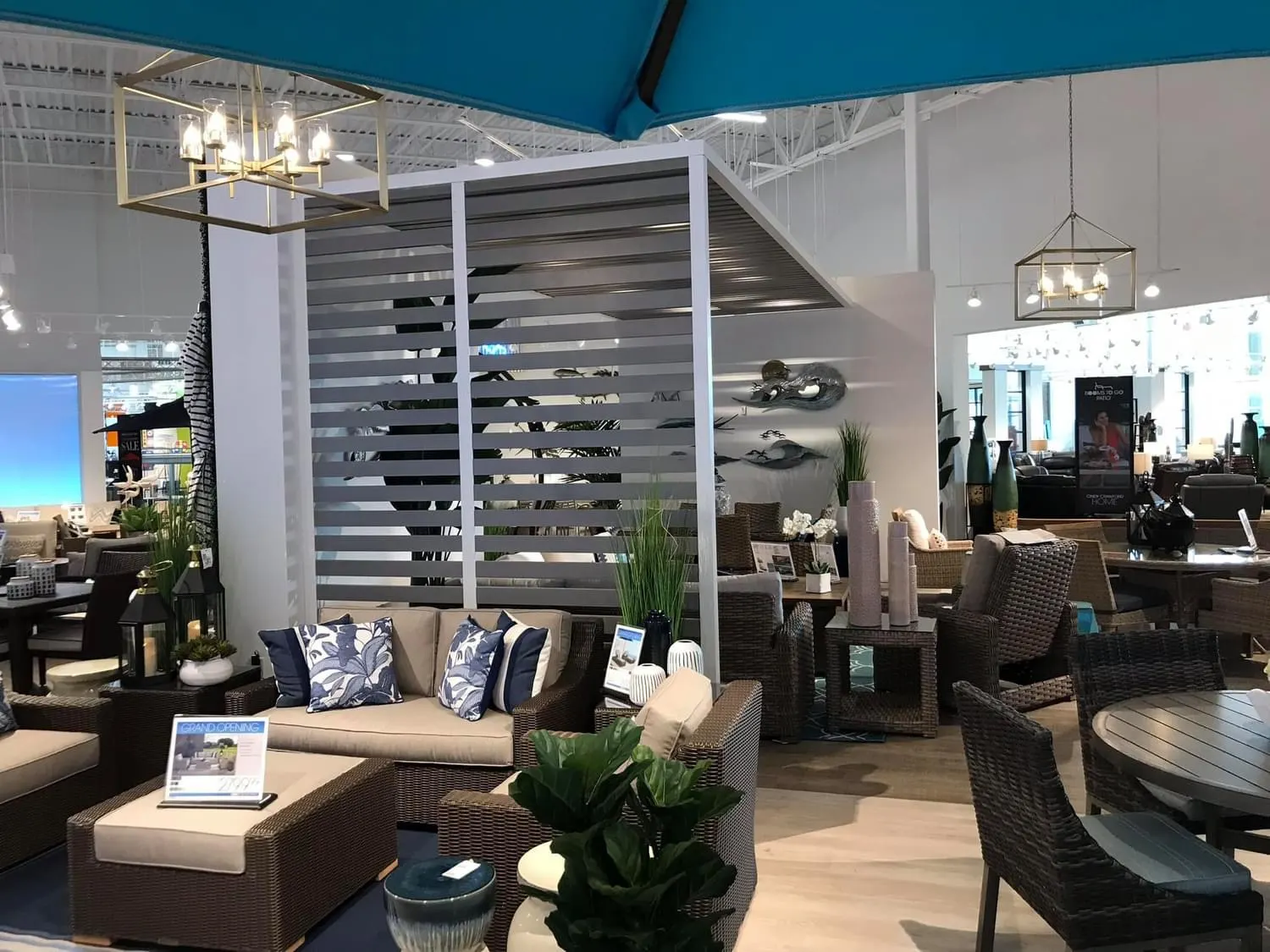 Furniture showroom interior with white walls and a teal ceiling