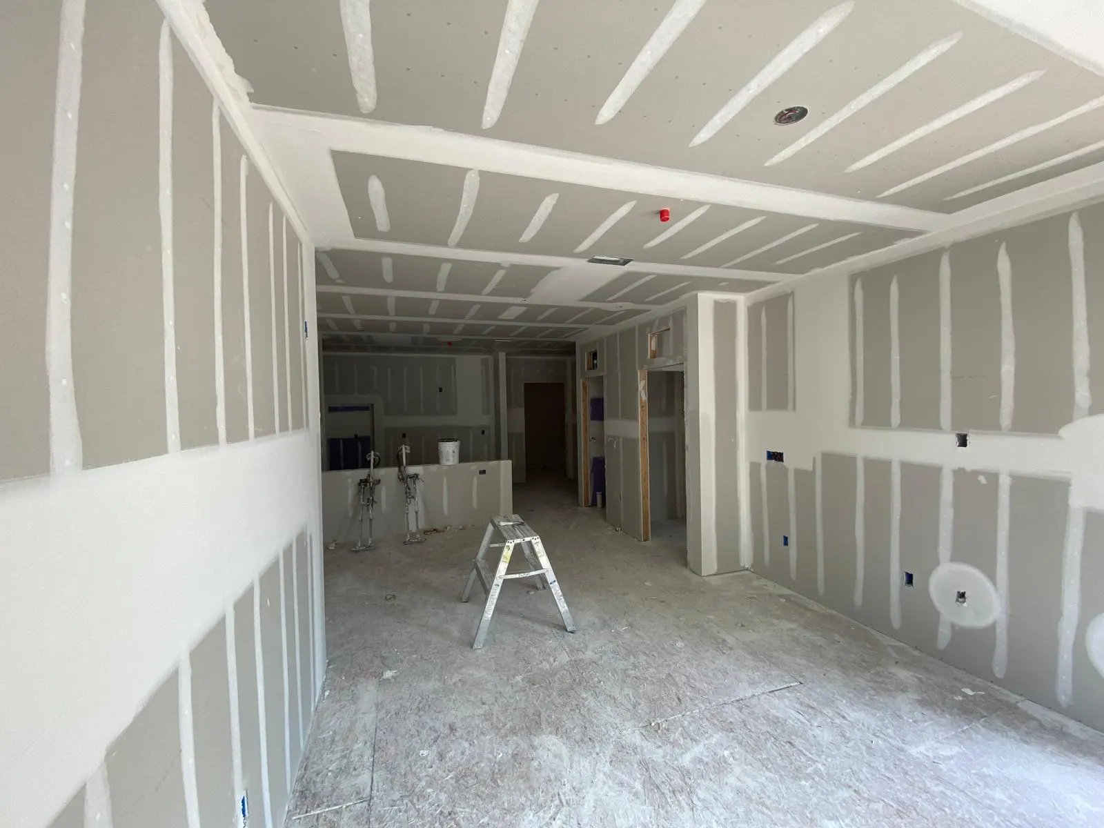 Commercial space with new drywall hung and taped